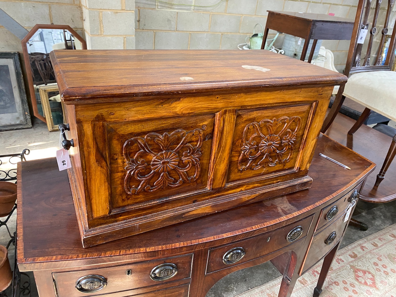 A modern carved hardwood trunk, length 80cm, depth 40cm, height 43cm